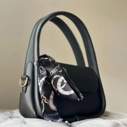 Stylish girls’ black handbag made from premium PU leather, featuring a simple design with a cute bow print (may vary). Compact, lightweight, and easy to carry with a sturdy top handle—perfect for daily use or special occasions.